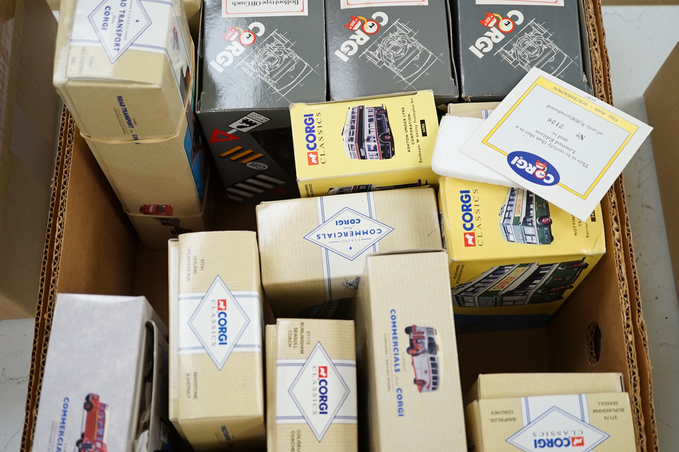 Twenty-two boxed Corgi Classics buses and coaches, etc., including a 50th anniversary Routemaster, Bedford OB coaches, etc.